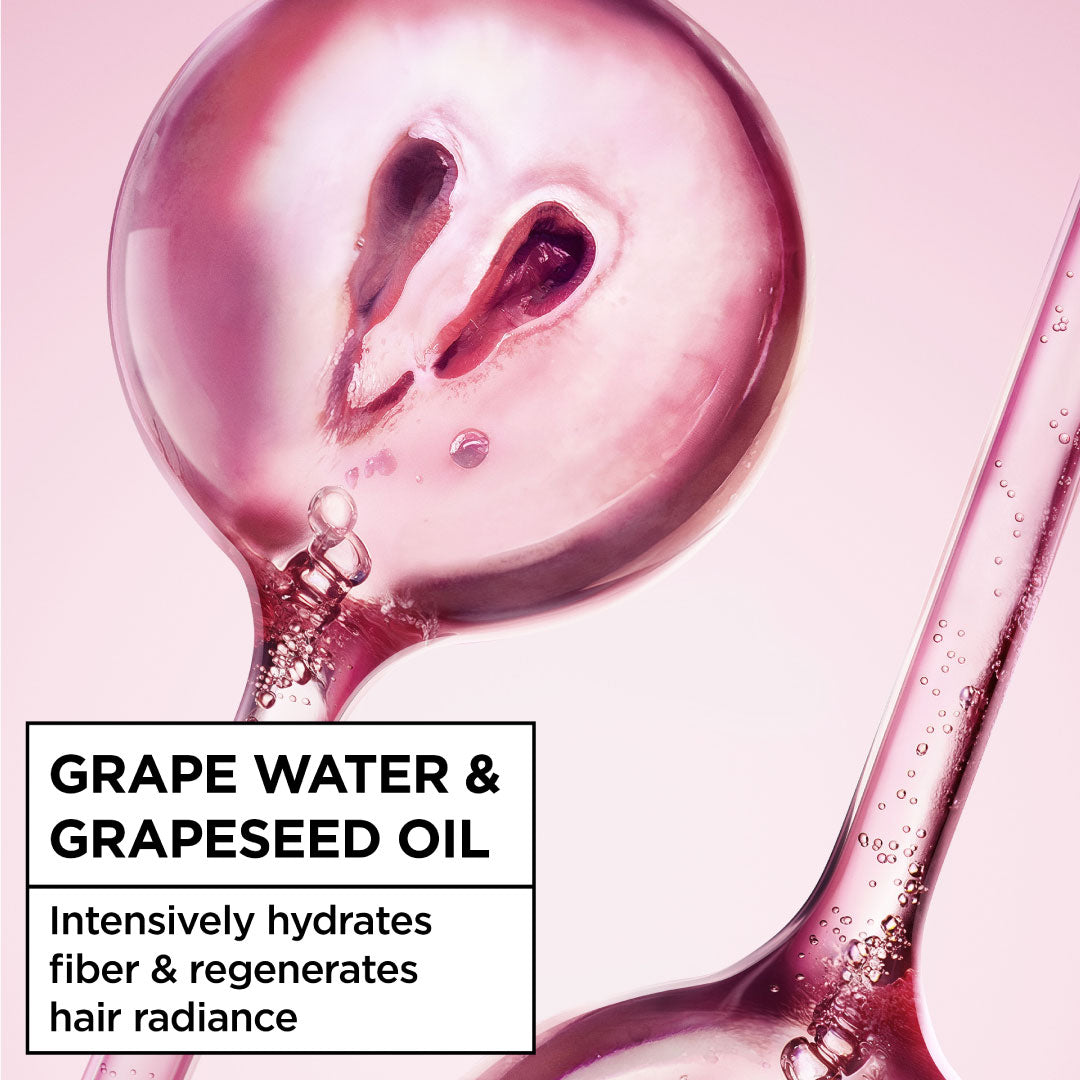 Grape water and grapeseed oil product with pink background